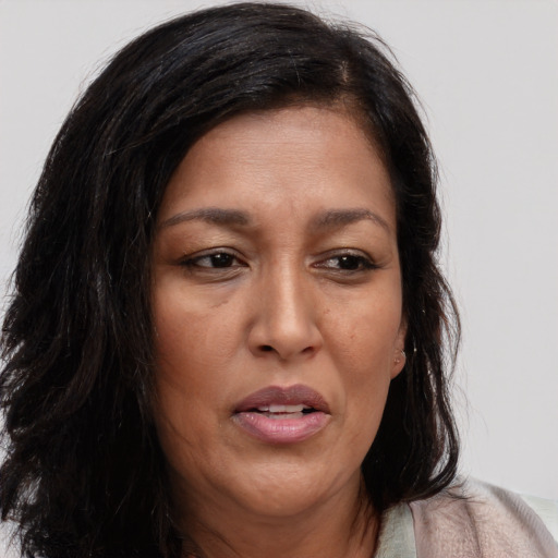Joyful asian adult female with medium  brown hair and brown eyes