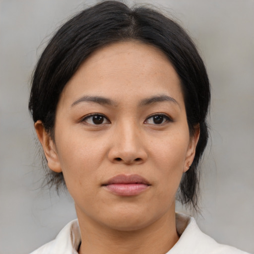 Neutral asian young-adult female with medium  black hair and brown eyes