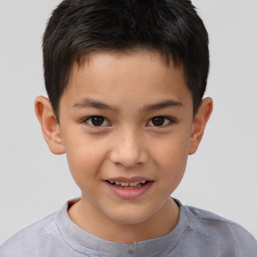 Joyful white child male with short  brown hair and brown eyes