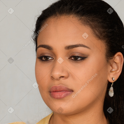 Joyful latino young-adult female with long  brown hair and brown eyes