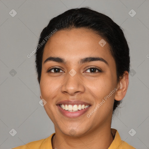 Joyful latino young-adult female with short  black hair and brown eyes