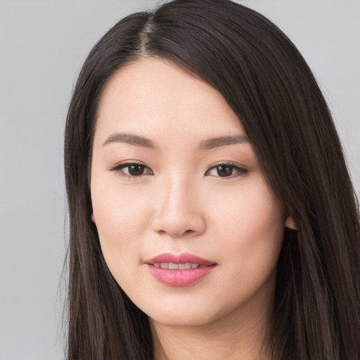 Joyful white young-adult female with long  black hair and brown eyes