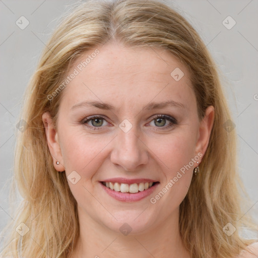 Joyful white young-adult female with medium  brown hair and blue eyes