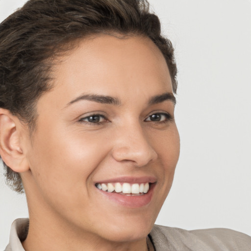 Joyful white young-adult female with short  brown hair and brown eyes