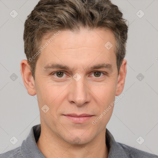 Joyful white adult male with short  brown hair and grey eyes