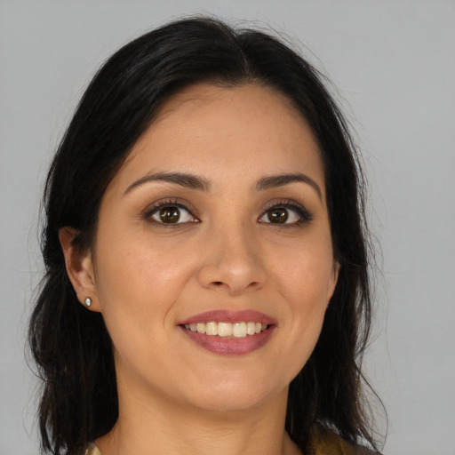 Joyful asian young-adult female with long  brown hair and brown eyes