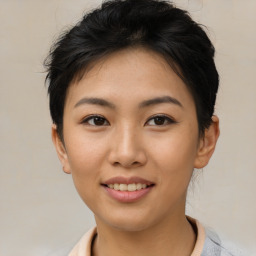 Joyful asian young-adult female with medium  black hair and brown eyes