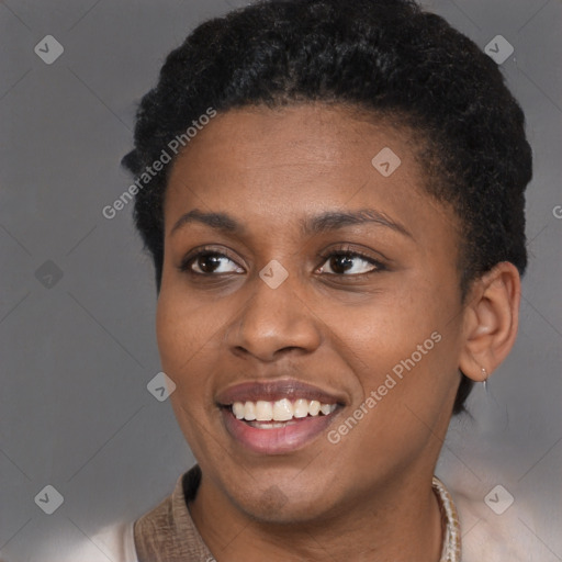 Joyful black young-adult female with short  brown hair and brown eyes