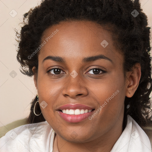 Joyful black young-adult female with long  brown hair and brown eyes