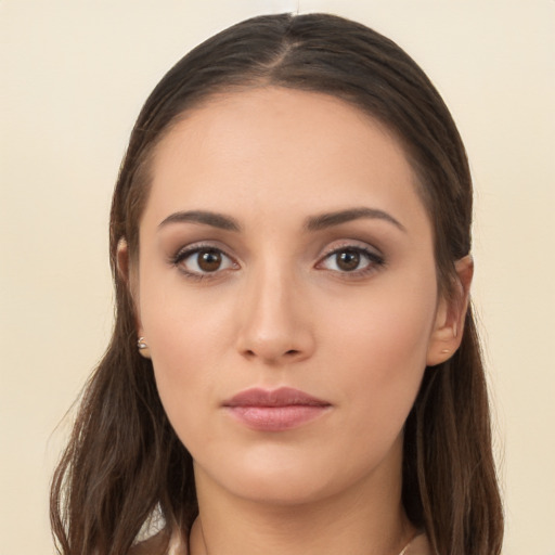 Neutral white young-adult female with long  brown hair and brown eyes