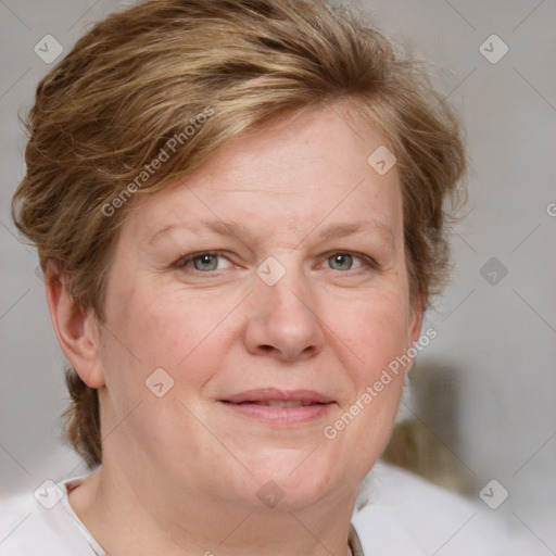 Joyful white adult female with medium  brown hair and blue eyes