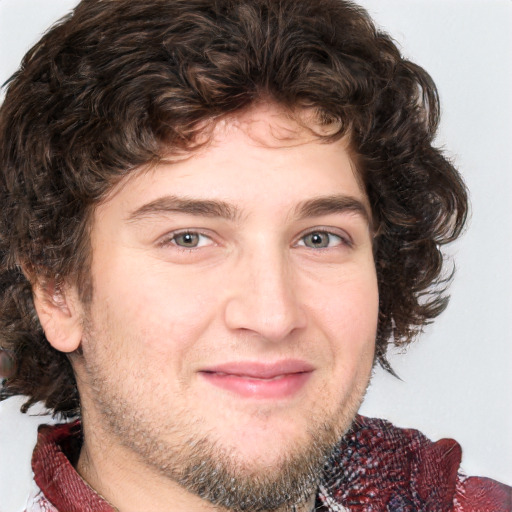 Joyful white young-adult male with medium  brown hair and brown eyes