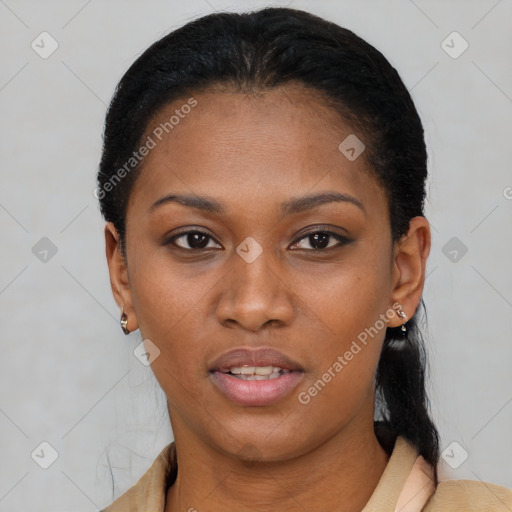 Joyful black young-adult female with short  black hair and brown eyes