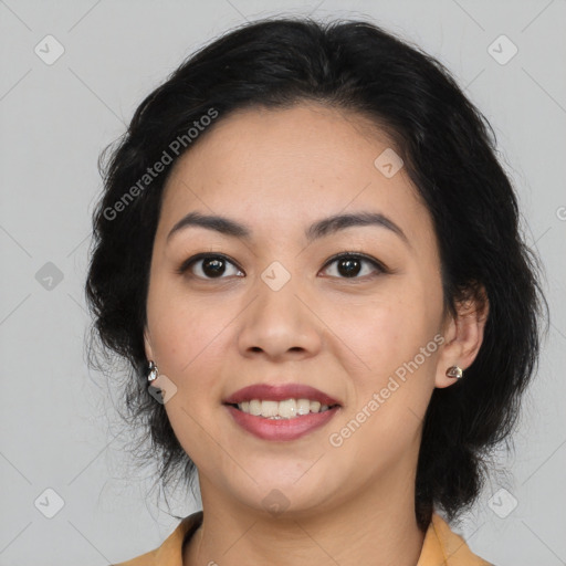 Joyful latino young-adult female with medium  brown hair and brown eyes