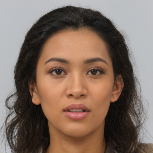 Joyful asian young-adult female with long  brown hair and brown eyes