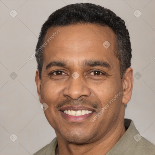 Joyful latino adult male with short  black hair and brown eyes