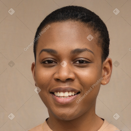 Joyful black young-adult female with short  black hair and brown eyes