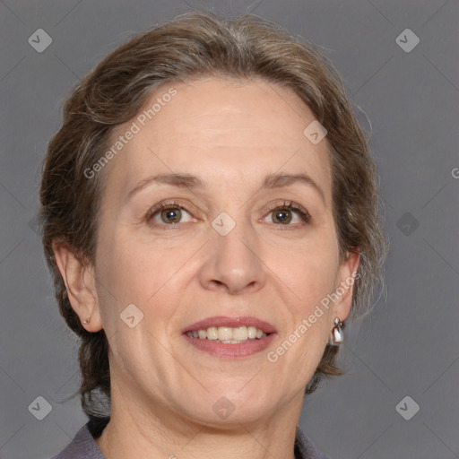 Joyful white adult female with medium  brown hair and grey eyes