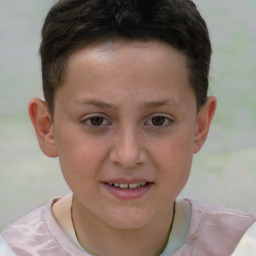 Joyful white child male with short  brown hair and brown eyes