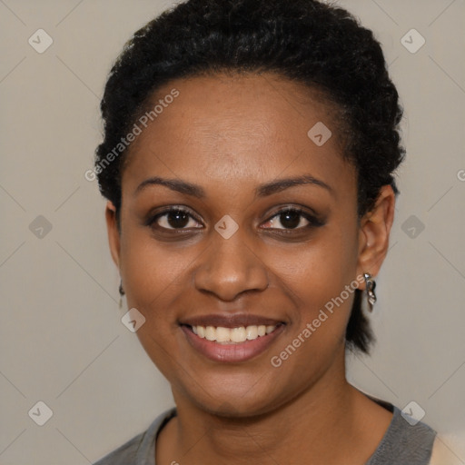 Joyful black young-adult female with short  black hair and brown eyes