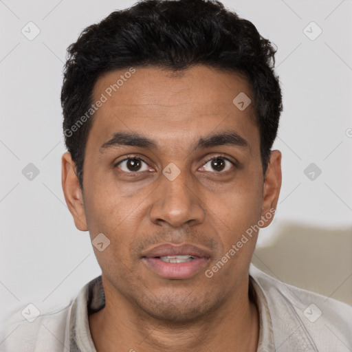 Joyful black young-adult male with short  black hair and brown eyes