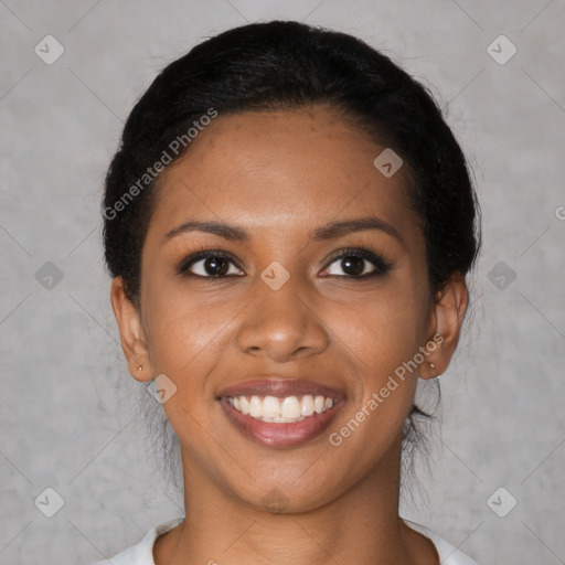 Joyful black young-adult female with medium  black hair and brown eyes