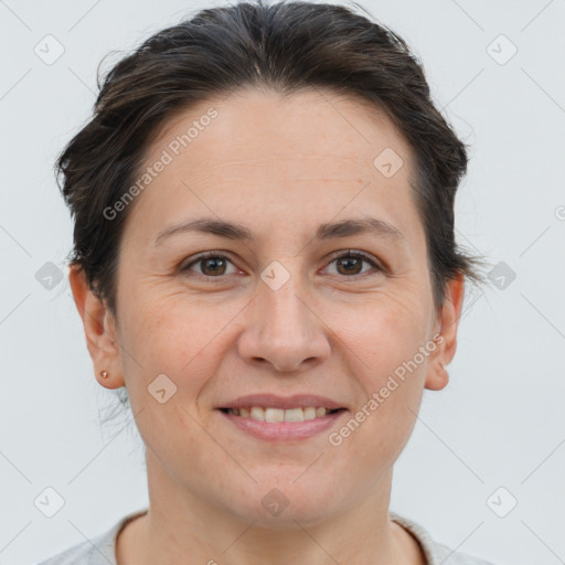 Joyful white adult female with short  brown hair and brown eyes