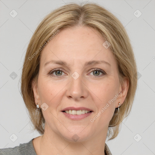 Joyful white adult female with medium  brown hair and grey eyes