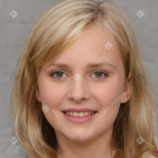 Joyful white young-adult female with long  brown hair and blue eyes