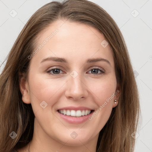 Joyful white young-adult female with long  brown hair and grey eyes