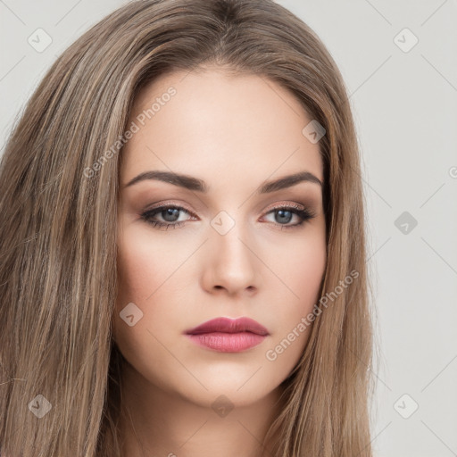 Neutral white young-adult female with long  brown hair and brown eyes