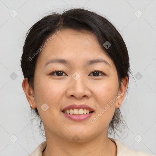 Joyful asian young-adult female with medium  brown hair and brown eyes