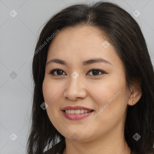 Joyful asian young-adult female with long  brown hair and brown eyes