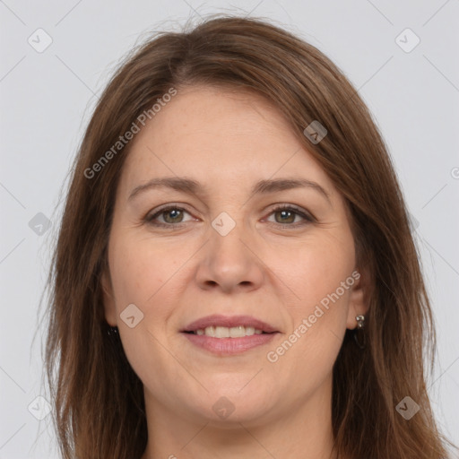 Joyful white adult female with long  brown hair and brown eyes