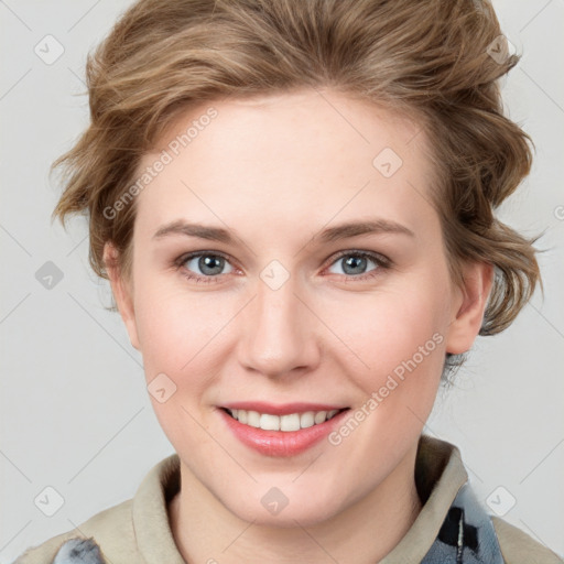 Joyful white young-adult female with medium  brown hair and blue eyes