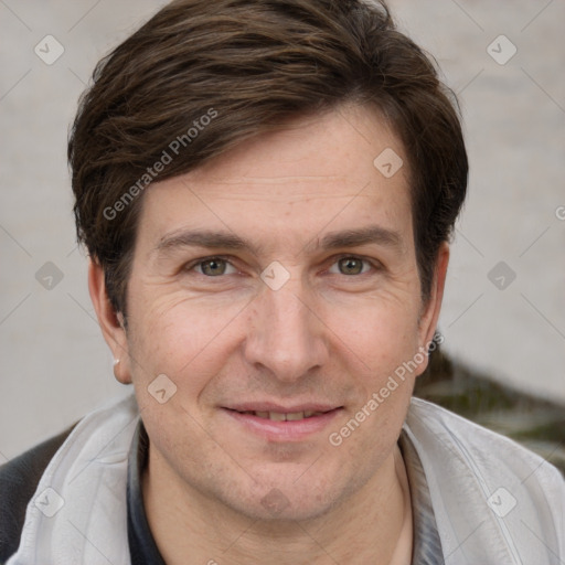 Joyful white adult male with short  brown hair and grey eyes