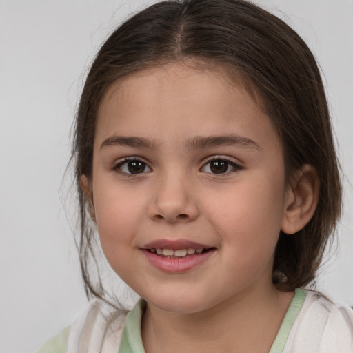 Joyful white child female with medium  brown hair and brown eyes