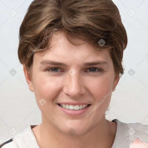 Joyful white young-adult female with short  brown hair and grey eyes