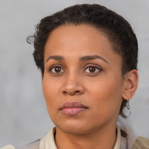 Neutral black young-adult female with short  brown hair and brown eyes