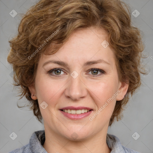 Joyful white adult female with medium  brown hair and blue eyes