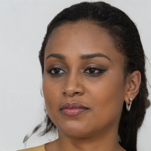 Neutral black young-adult female with long  black hair and brown eyes