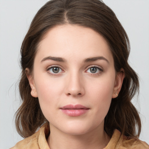 Neutral white young-adult female with medium  brown hair and brown eyes