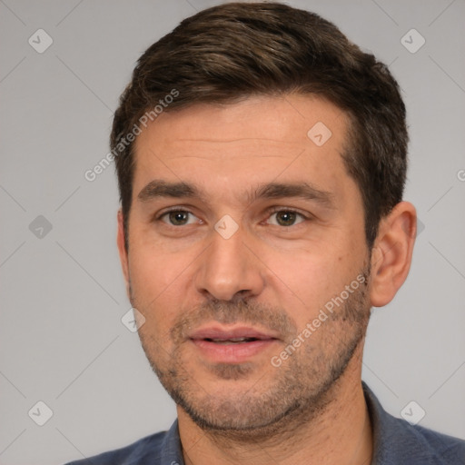 Joyful white adult male with short  brown hair and brown eyes