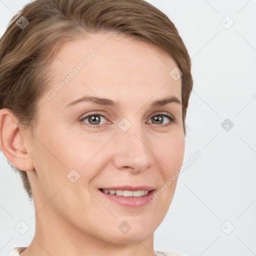 Joyful white young-adult female with short  brown hair and grey eyes