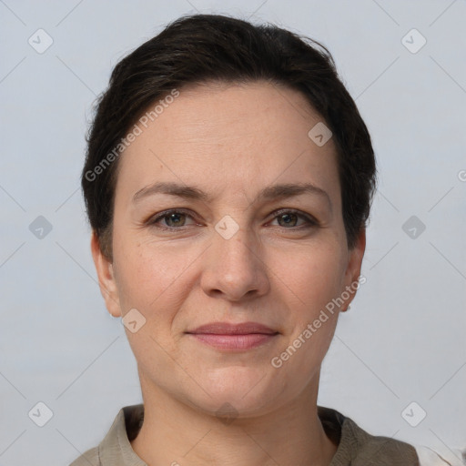 Joyful white adult female with short  brown hair and brown eyes