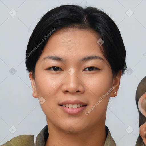 Joyful asian young-adult female with short  brown hair and brown eyes