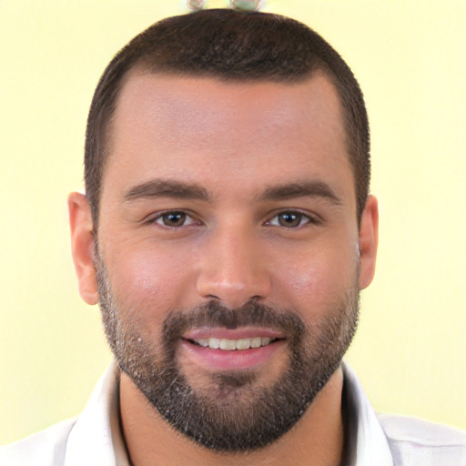 Joyful white young-adult male with short  brown hair and brown eyes