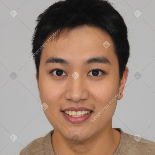 Joyful asian young-adult male with short  black hair and brown eyes