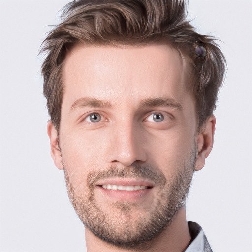 Joyful white adult male with short  brown hair and grey eyes