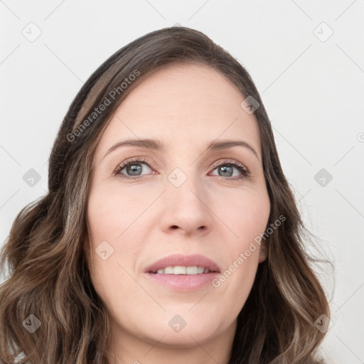 Joyful white young-adult female with long  brown hair and green eyes